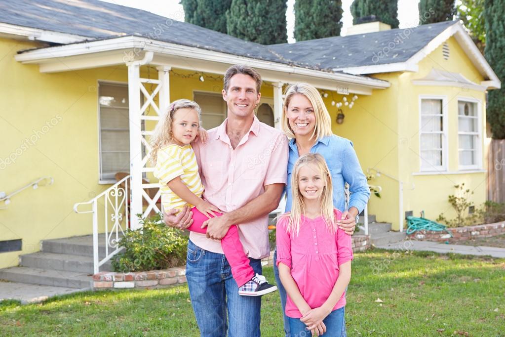 depositphotos_25049951-stock-photo-family-standing-outside-suburban-home